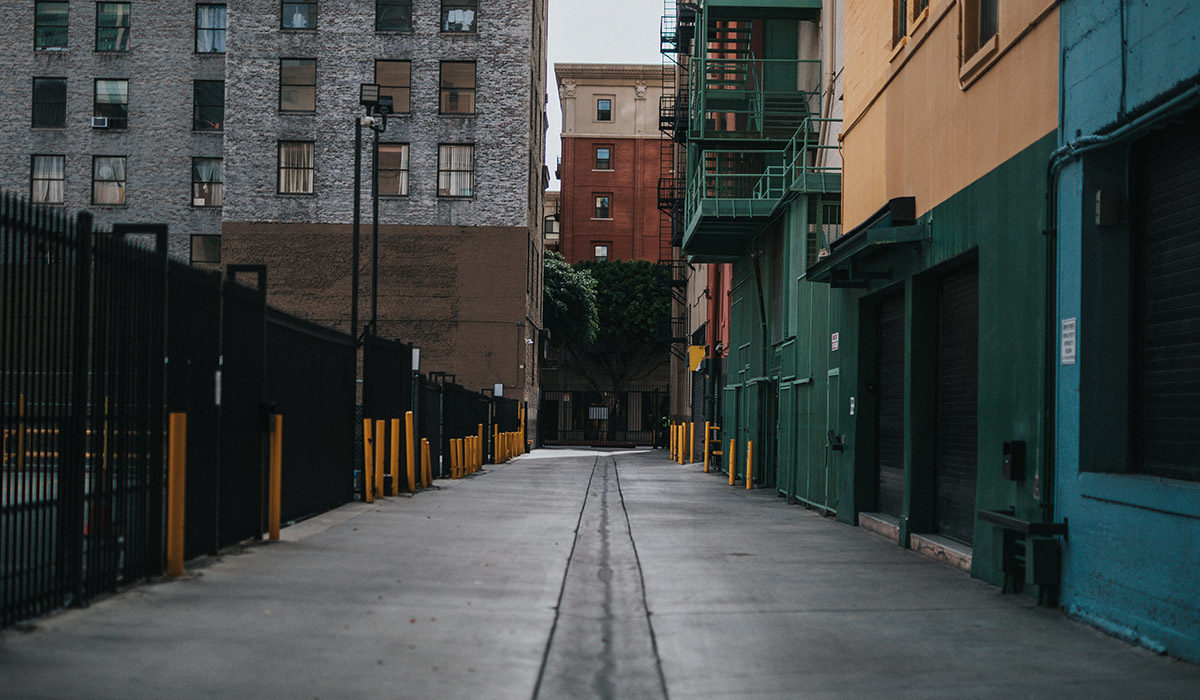 train tracks down the back of an alley