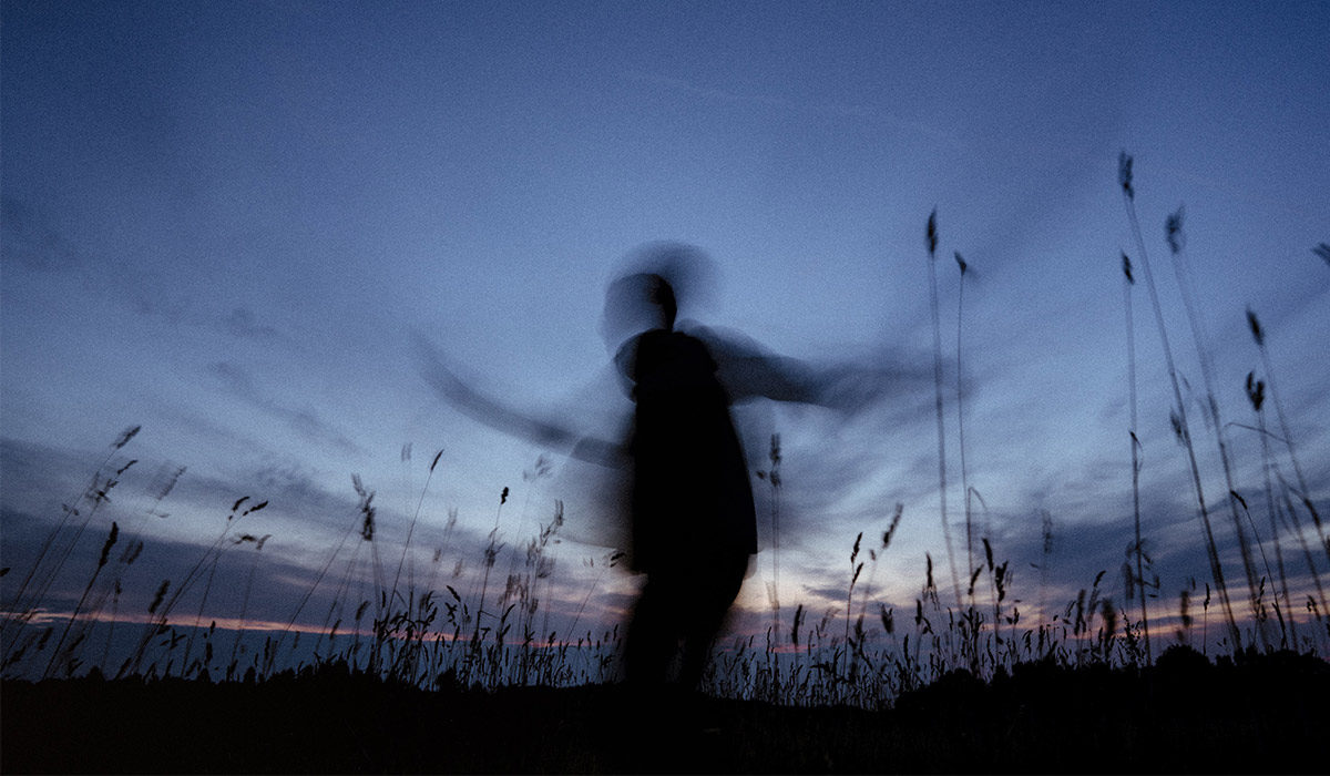 a blurred silhouette of a person