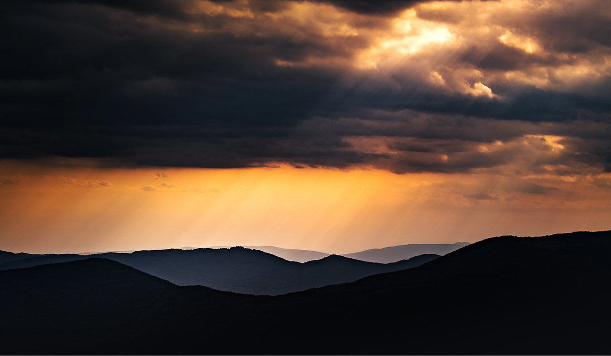 sun streaming through the clouds